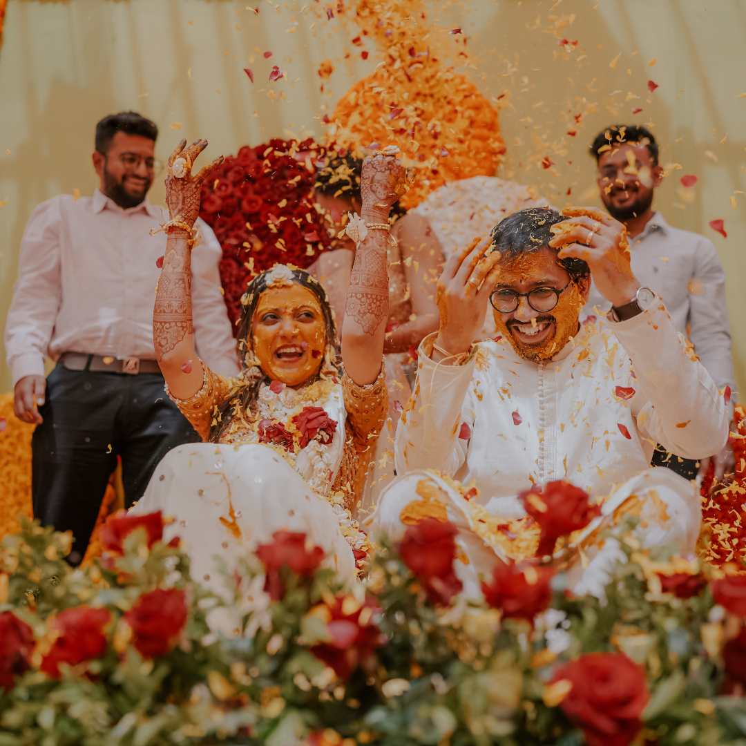 a man and woman with Turmeric on their face