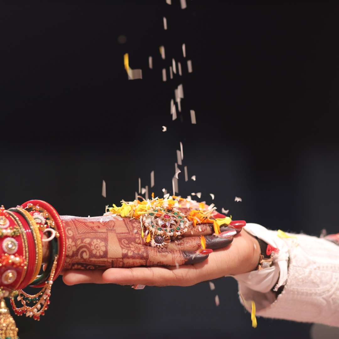 a bride hold her hand on groom's hand